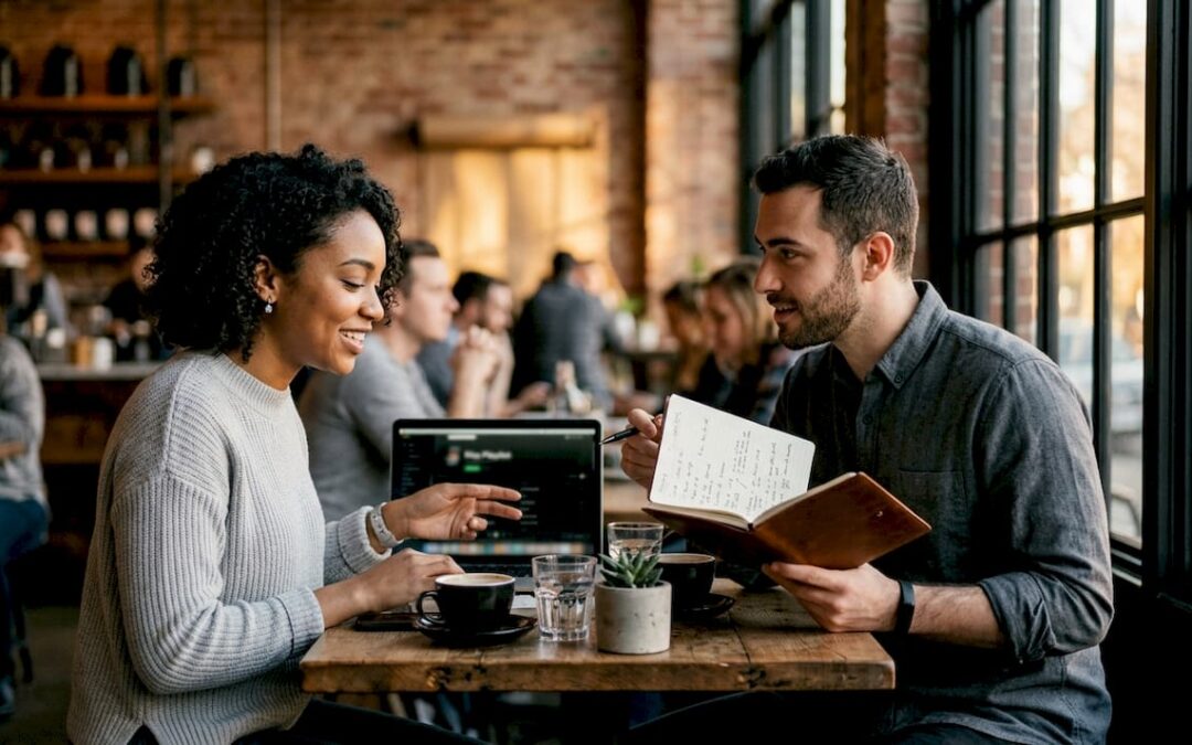 Couple planning wedding music with devices