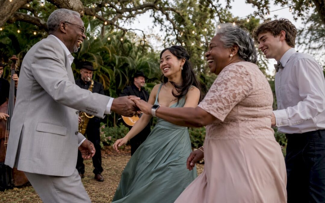 Multi-generational group dancing at wedding reception
