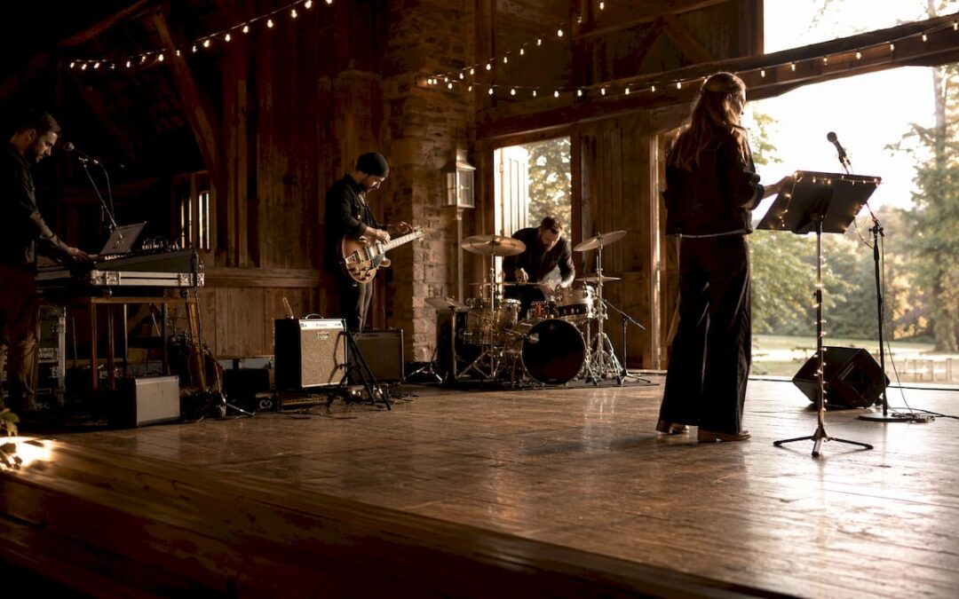 Band setting up instruments on stage before live event