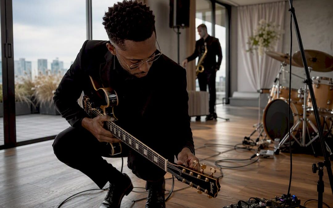 Musician tuning guitar at wedding venue