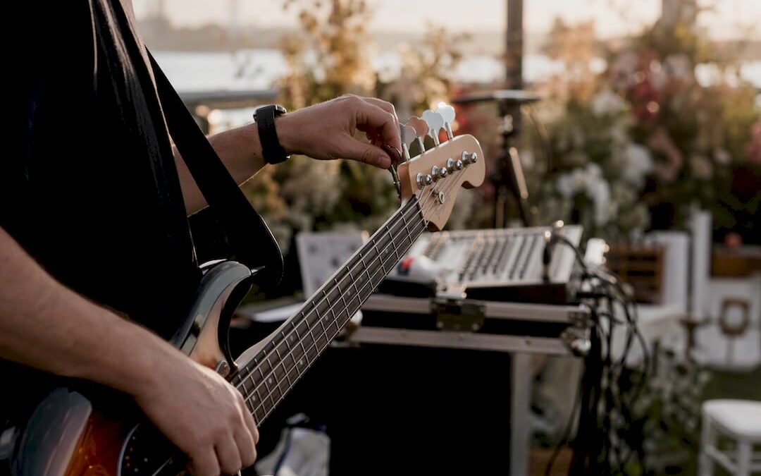 Live band setting up instruments at wedding venue